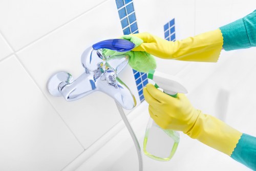 Technician deep cleaning tile floors